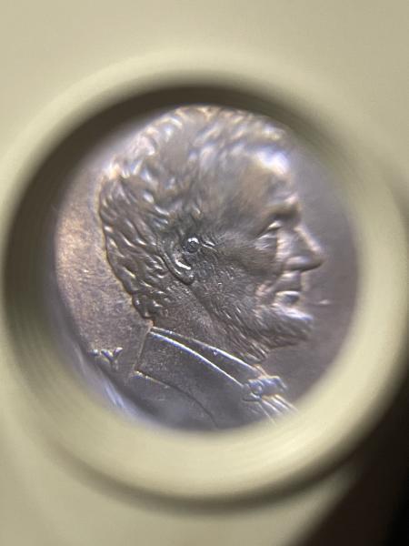 1991 penny with a circular error near ear&hellip;