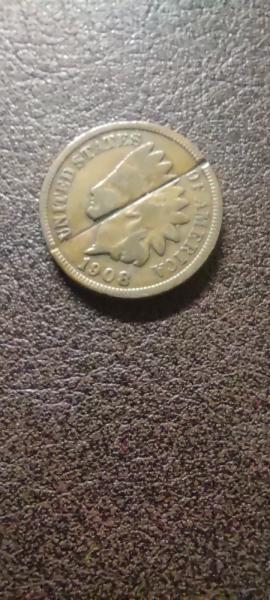1908 Indian Head penny with a cut across…