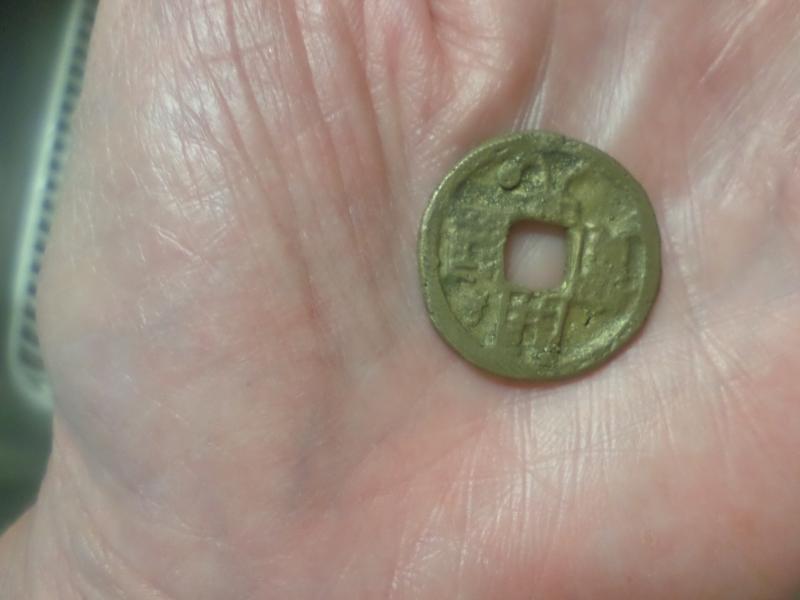 Old Chinese coin Size of a quarter. Smooth on back.