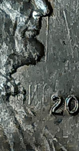 It's a 2023 penny with letters on the&hellip;