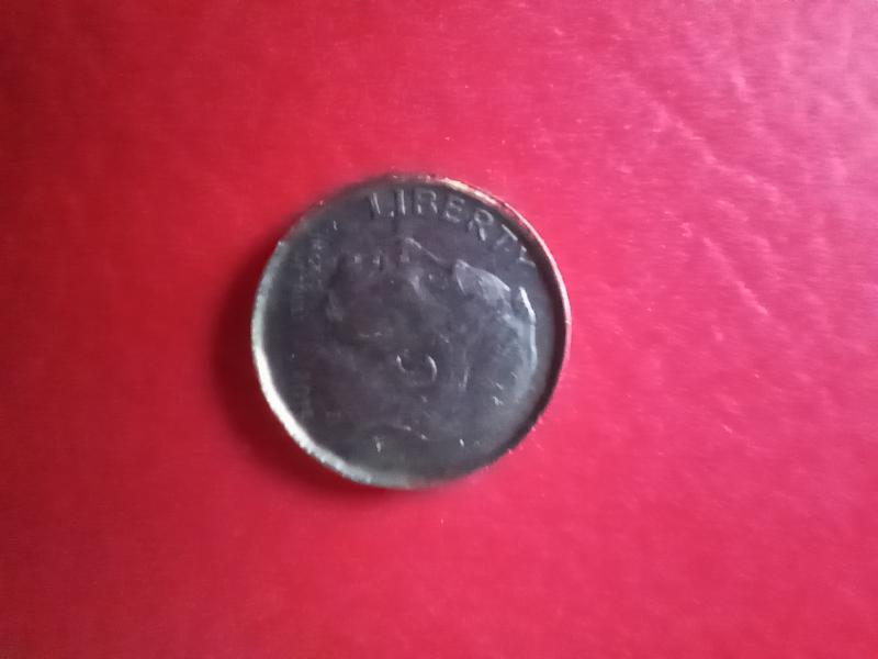 2015 dime stamped on a penny