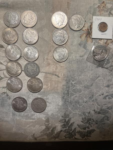 Several Morgan peace, liberty dollars