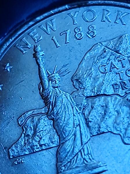 New York State quarter top of liberty statue