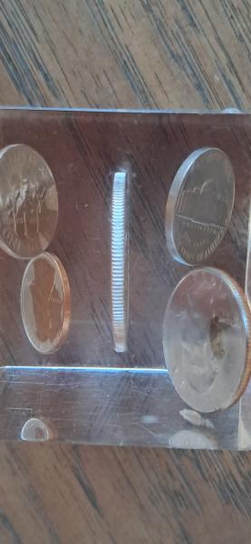 I found this paper weight with coins encased&hellip;