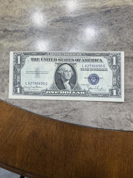 One dollar silver certificate. The front is printed&hellip;