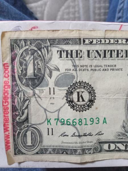 Doller bill with alien on front an back of bill&hellip;