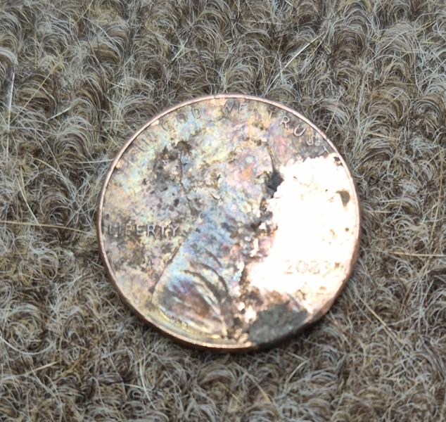 Coin is in good condition aside from the few scatches