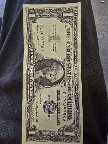 1957a silver certificate..... slightly off center printing on…