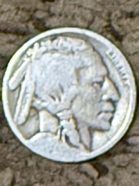 Buffalo Nickel with a significant cross above the buffalo