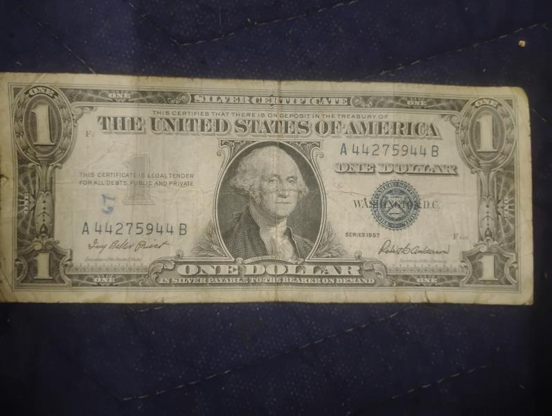 It's a 57 silver certificate dollar.