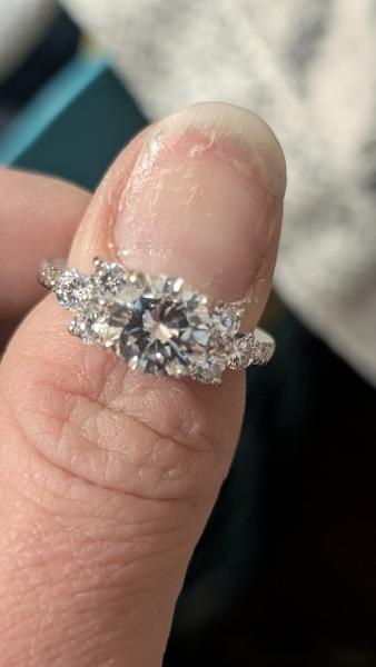 Diamond engagement ring round center stone.